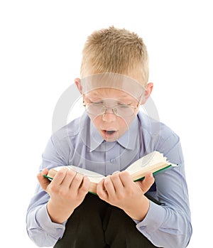 Amazed boy reading very interesting book