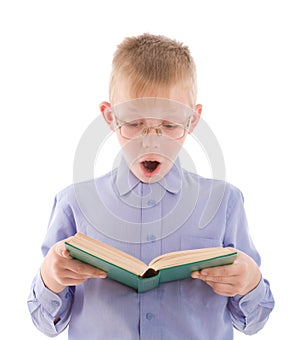 Amazed boy reading very interesting book