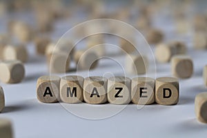 Amazed - cube with letters, sign with wooden cubes