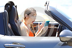 Amazed driver watching media content in a smart phone