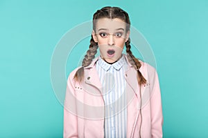 Amazed or excited portrait of beautiful cute girl standing with