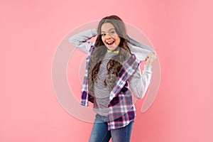 amazed girl has wavy hairdo. portrait of frizz child. haircare and skincare. hairdresser.