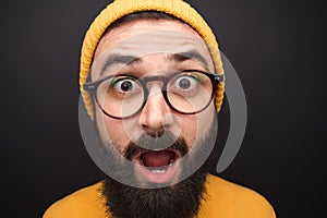 Amazed hipster man in closeup