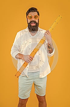 amazed man hold measuring ruler on background. photo of man hold measuring ruler.