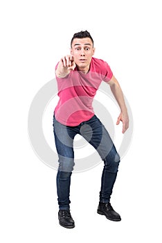 Amazed man pointing to front. White background