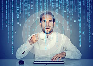 Amazed man software engineer coding using a computer and holding a cup of coffee