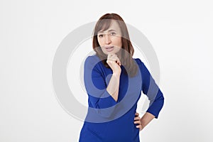 Amazed middle aged woman isolated on a white background. Copy space