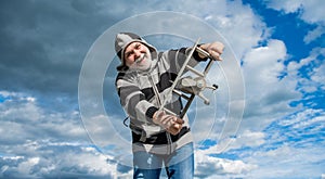 amazed senior man on sky background. senior man at retirement. senior retired man with toy plane