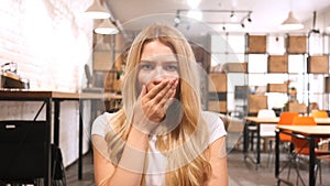 Amazed , Shocked Blonde Girl Sitting in Office