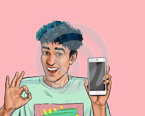 Amazed smiling man shows ok sign with phone in the hand in comic style. Pop art man in hat holding smartphone.