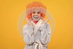 amazed teen girl in fancy orange wig hair wear home bathrobe, amazement