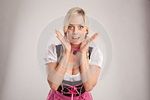 Amazed woman with dirndl