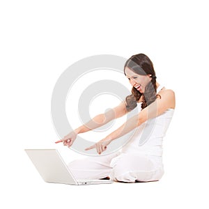 Amazed woman looking at laptop