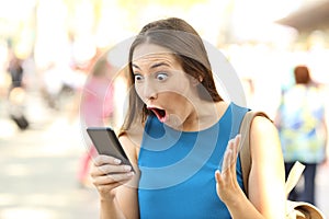 Amazed woman receiving shocking news
