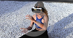 amazed young beautiful girl testing virtual reality 3D video glasses VR headset