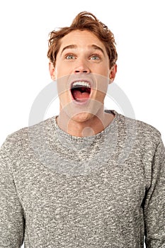 Amazed young guy with open mouth