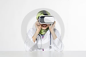 Amazed young women wearing virtual reality goggles over abstract