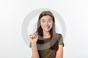 Amazement - woman excited looking to the side. Surprised happy young woman looking sideways in excitement. Mixed race