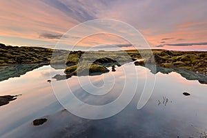 Amazinf sunset in Iceland lake.