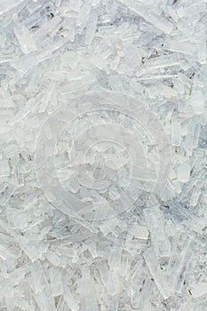 Amazing abstract broken ice crystals texture. Clear melting ice background