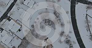 Amazing aerial with small town USA main street hometown the after snowfall severe winter weather conditions in snow