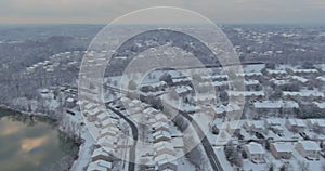 Amazing aerial with small town USA main street hometown the after snowfall severe winter weather conditions in snow