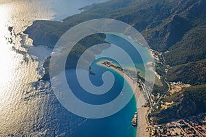 Amazing aerial view of Blue Lagoon in beach resort in the Fethiye district - Oludeniz.  Turkey. Summer landscape with mountains, g