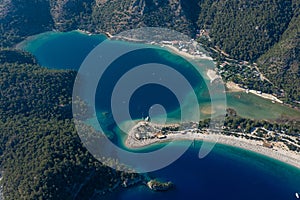 Amazing aerial view of Blue Lagoon in beach resort in the Fethiye district - Oludeniz.  Turkey. Summer landscape with mountains, g