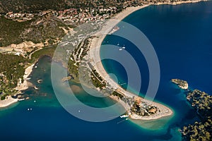 Amazing aerial view of Blue Lagoon in beach resort in the Fethiye district - Oludeniz.  Turkey. Summer landscape with mountains, g