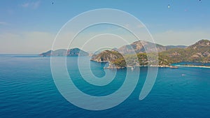 Amazing aerial view of Blue Lagoon in Oludeniz, Turkey. Summer landscape with mountains, green forest, azure water and