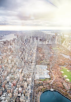 Amazing aerial view of Central Park and New York skyline on a cloudy day from helicopter, USA