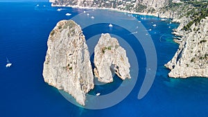 Amazing aerial view of Faraglioni in summer season. Rock natural formations in Capri Island, Italy