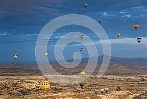 Amazing aerial view of hot air balloons at sunrise in Goreme National Park. Cappadocia.Turkey.