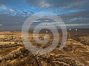 Amazing aerial view of hot air balloons at sunrise in Goreme National Park. Cappadocia.Turkey.