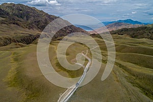 Amazing aerial view at road in the mountain.Road through hills