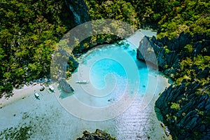 Amazing aerial view of turquoise Cadlao lagoon hopping island El Nido Palawan Philippines. Stunning nature place