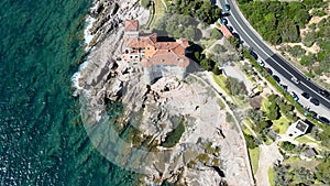 Amazing aerial view of Tuscany coastline in Calafuria area, Italy. Slow motion