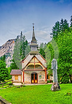 Amazing alpine scenery with small chapel at Lago di Braies Lake, Dolomite Alps, South Tyrol, Italy