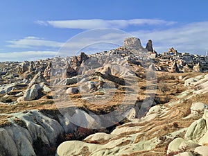 An amazing ancient cave city ascending afar in Cappadocia, Turkey