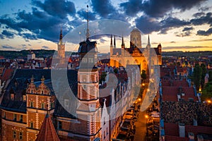 Amazing architecture of the main city in Gdansk at sunset, Poland. Aerial view of the Long Market, Main Town Hall and St. Mary