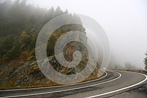 Amazing autumn morning view of foggy Transfagarasan road in Transylvania, Romania