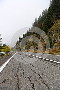 Amazing autumn morning view of foggy Transfagarasan road in Transylvania, Romania