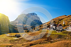 Amazing autumn view on Sassolungo mountain and Gardena Pass. Dolomite Alps, South Tyrol, Italy.