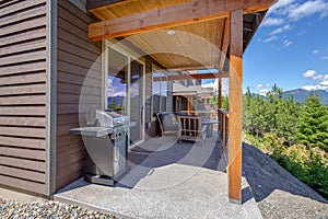 Amazing balcony patio with fire pit and forest and mountains view. Dream come true home exterior. New AMerican architecture.