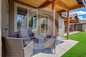 Amazing balcony patio with fire pit and forest and mountains view. Dream come true home exterior. New AMerican architecture.