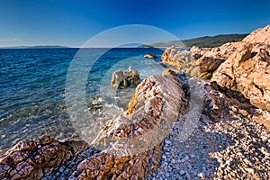 Amazing beach with cristalic clean sea water with pine trees in