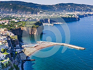 Amazing beach of Sorrento coast with typical bathhouse in a bright sunny day, southern Italy