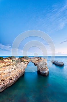 Amazing beach at sunrise. Algarve is located in the south of Portugal and is a vacation destination for many tourists. Your stone