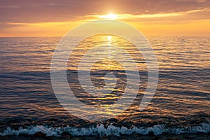 Amazing beach sunset with endless horizon. Horizontal. Selective focus.