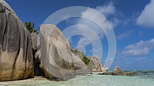 Amazing beach on a tropical island. Boulders in the turquoise ocean